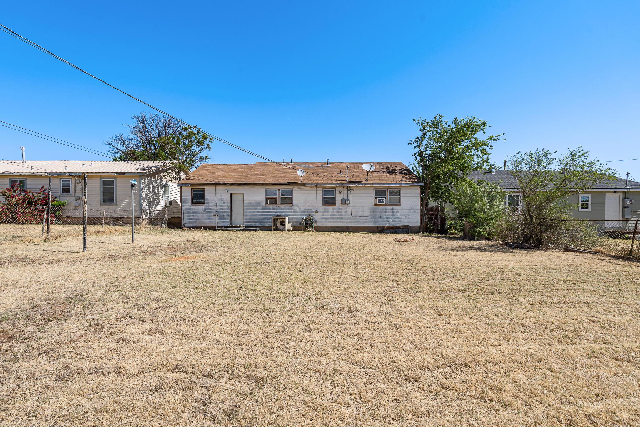 106 Peiffer Street Borger, TX 79007 - Photo 12 of 12 a front view of a house with a yard and garage
