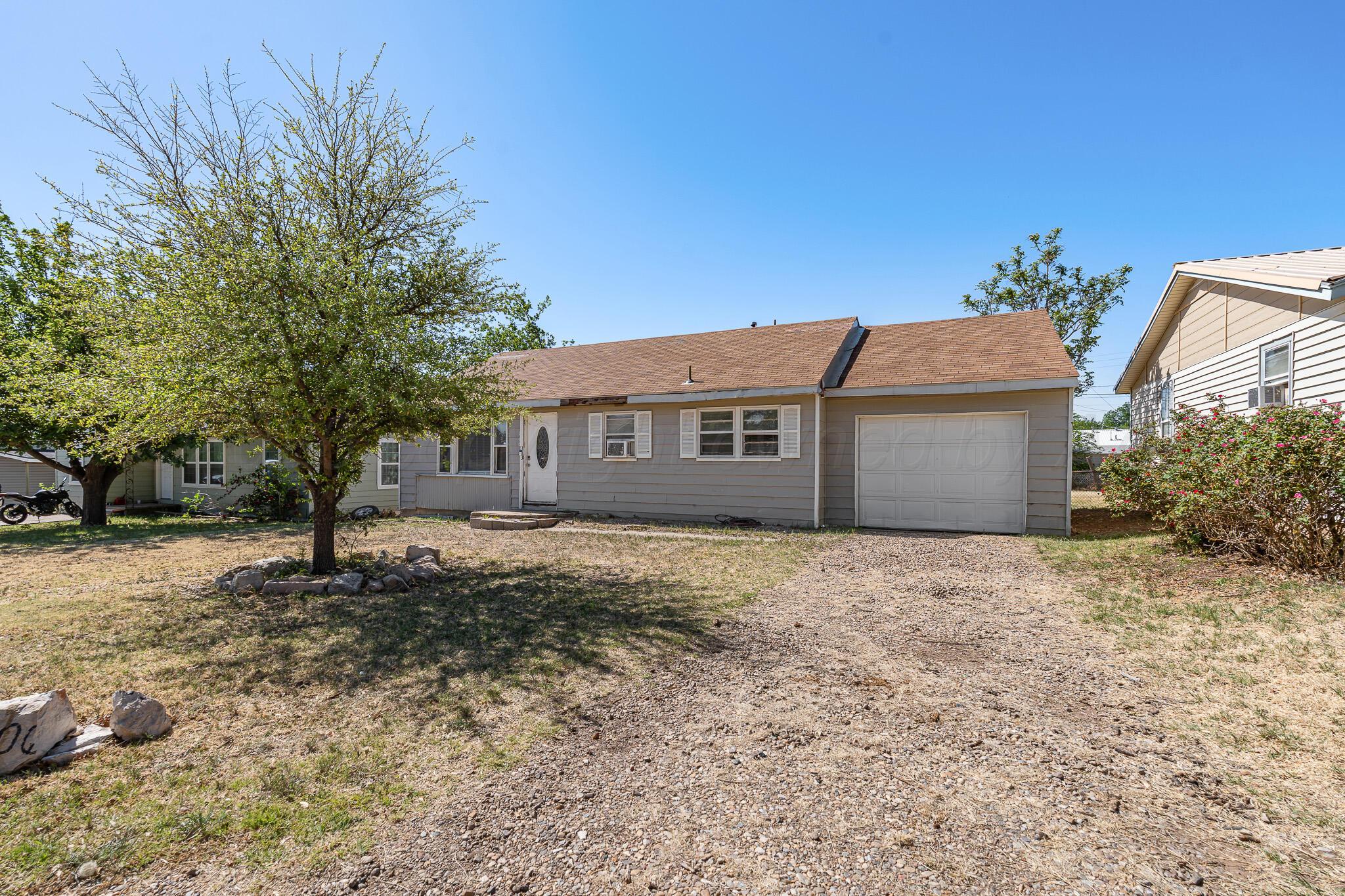106 Peiffer Street Borger, TX 79007 - Photo 2 of 12 a front view of a house with a yard