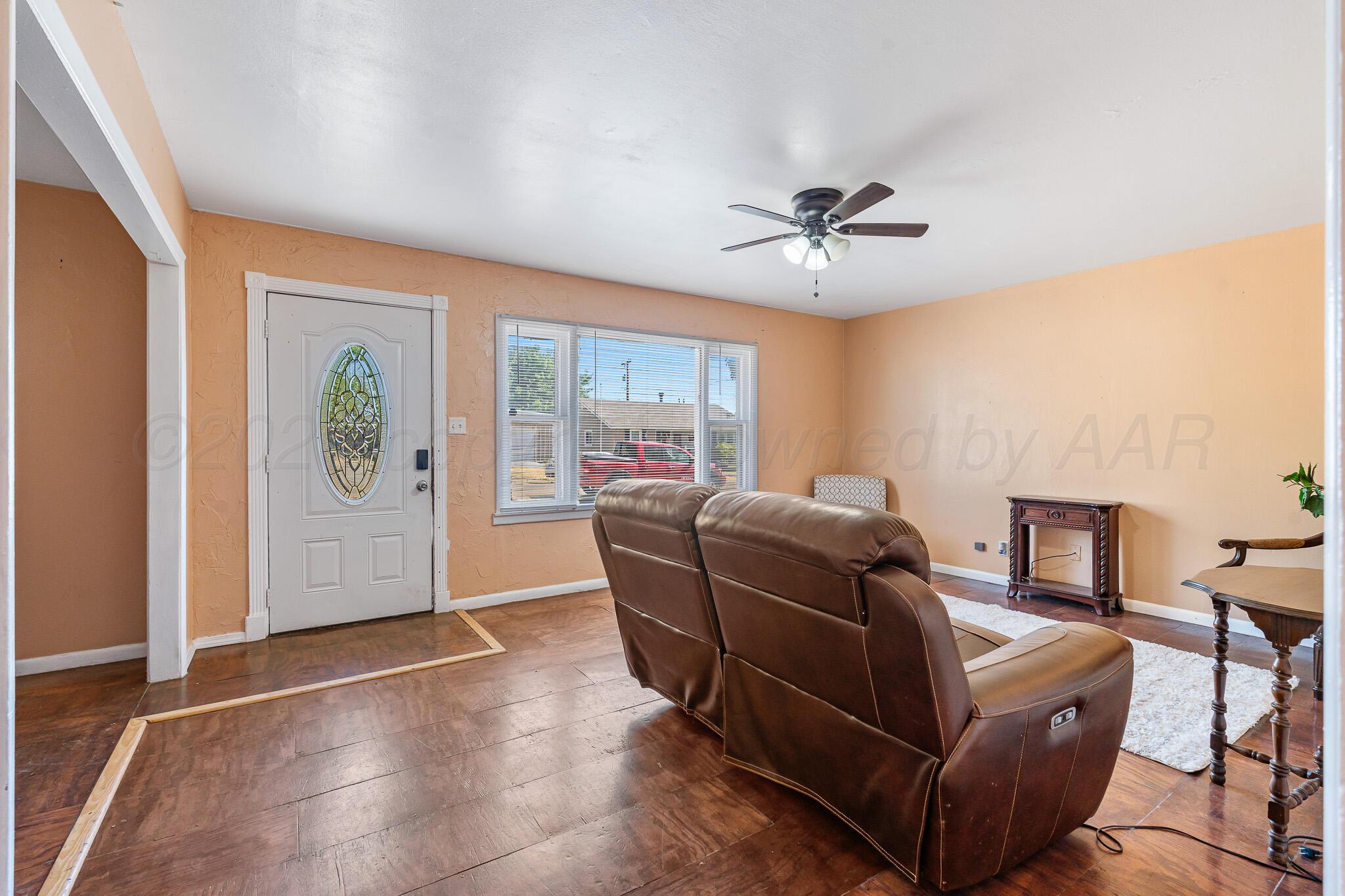 106 Peiffer Street Borger, TX 79007 - Photo 4 of 12 a living room with furniture and a window