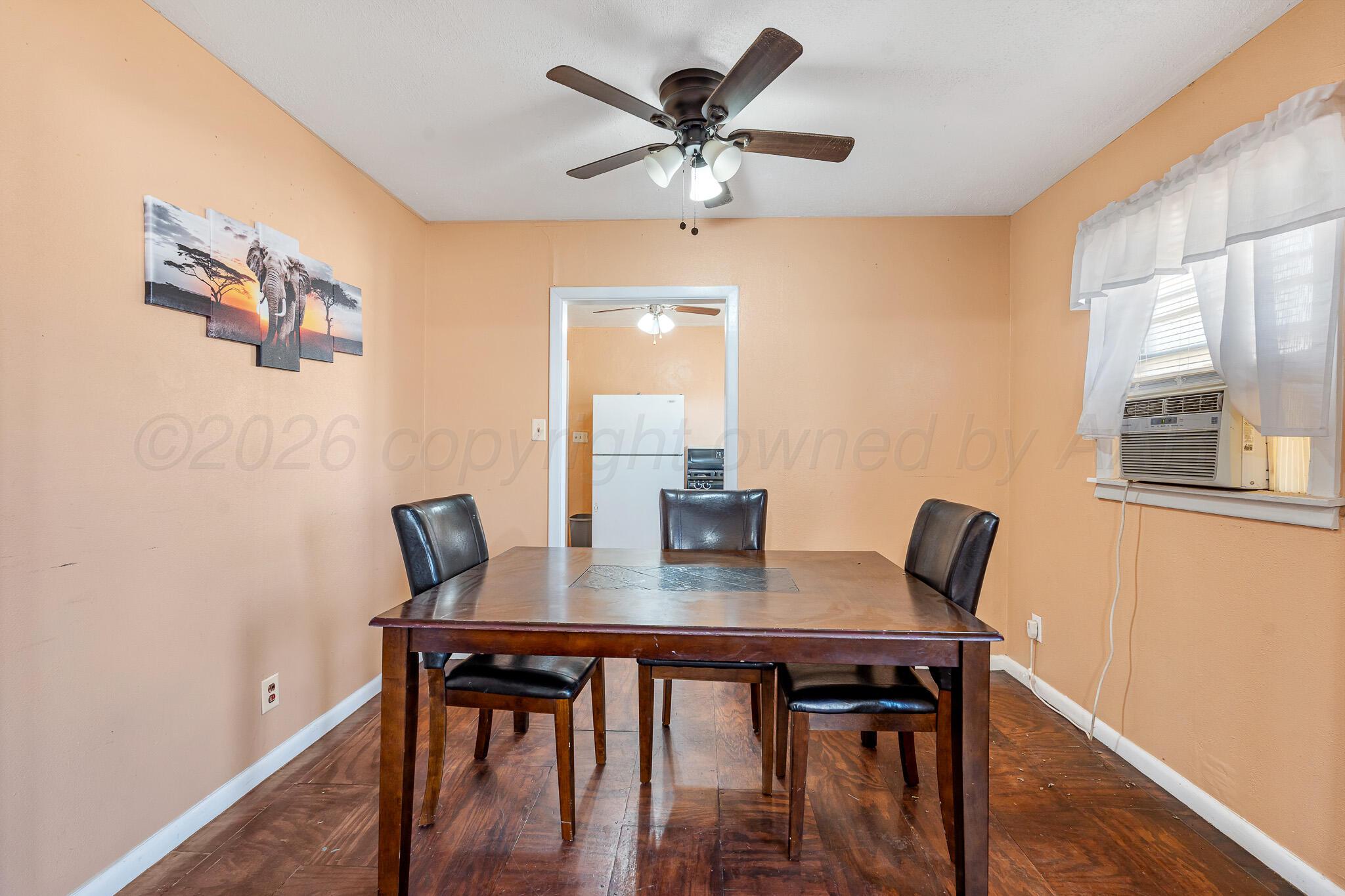 106 Peiffer Street Borger, TX 79007 - Photo 8 of 12 a view of a dining room with furniture and wooden floor