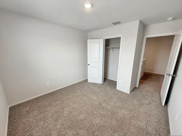 a view of a livingroom with an empty space and wooden floor
