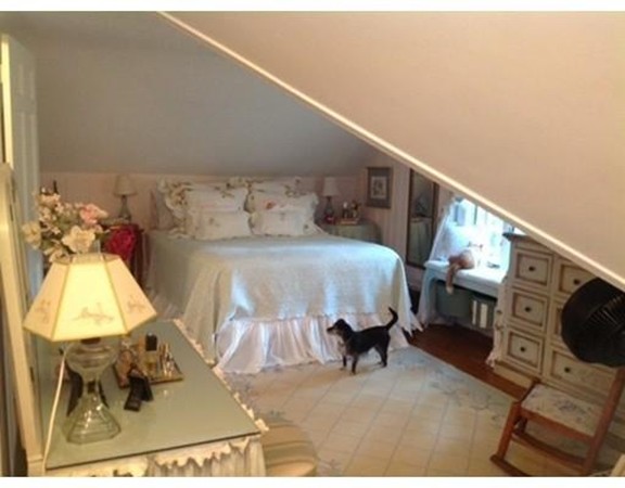 6 McGregory Road Sturbridge, MA 01566 - Photo 17 of 27 a bedroom with furniture and a mirror