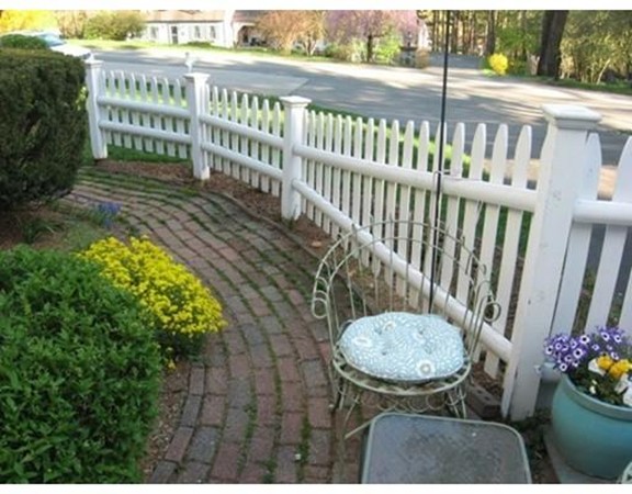 6 McGregory Road Sturbridge, MA 01566 - Photo 4 of 27 a view of a chair and table in the balcony