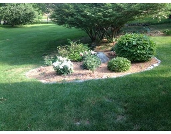 6 McGregory Road Sturbridge, MA 01566 - Photo 5 of 27 a view of a garden with a lake