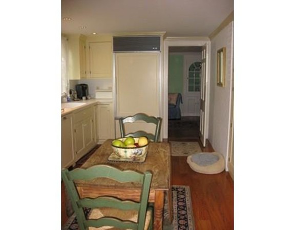 6 McGregory Road Sturbridge, MA 01566 - Photo 8 of 27 a view of a dining room with furniture and wooden floor