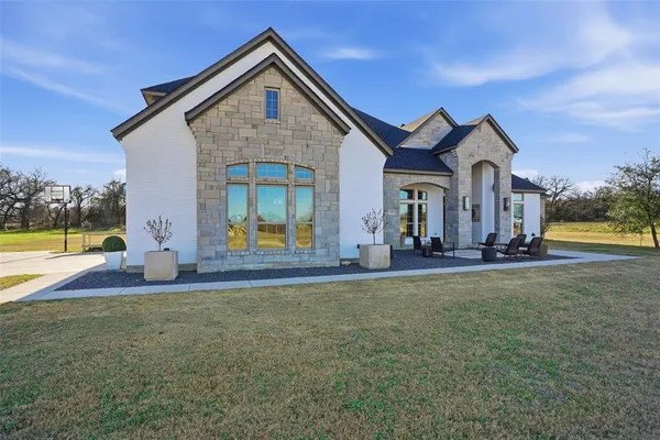 a front view of a house with a yard