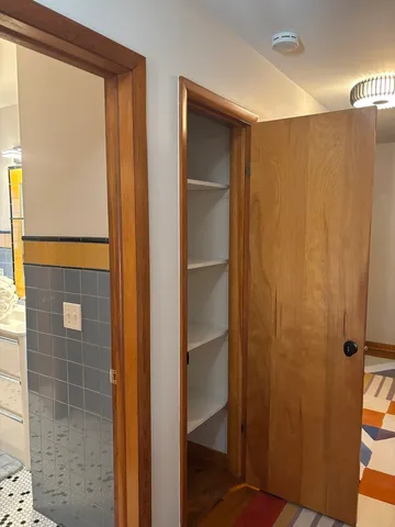 a view of walk in closet with window