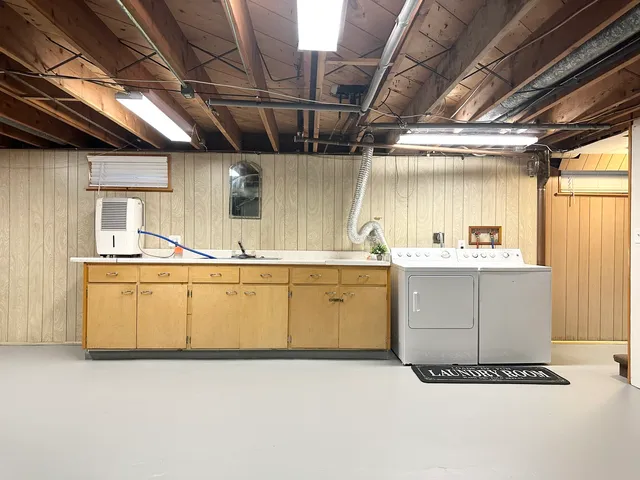 a view of a patio with table and chairs with wooden floor and fence