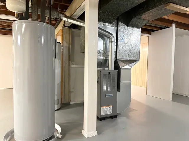 a view of a lake with houses in the back