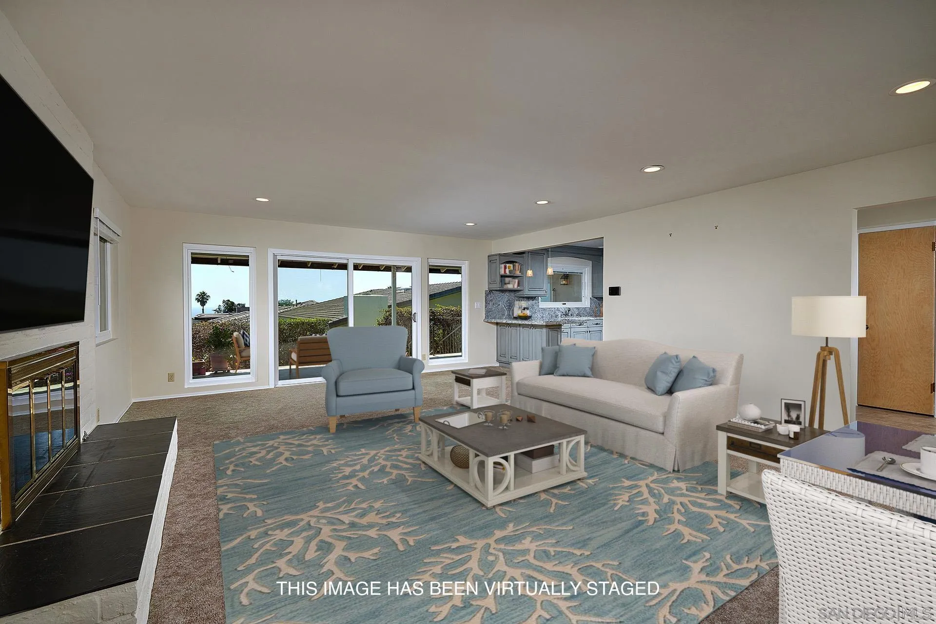 5560 Moonlight Lane La Jolla, CA 92037 - Photo 19 of 48 a living room with furniture large windows and a flat screen tv