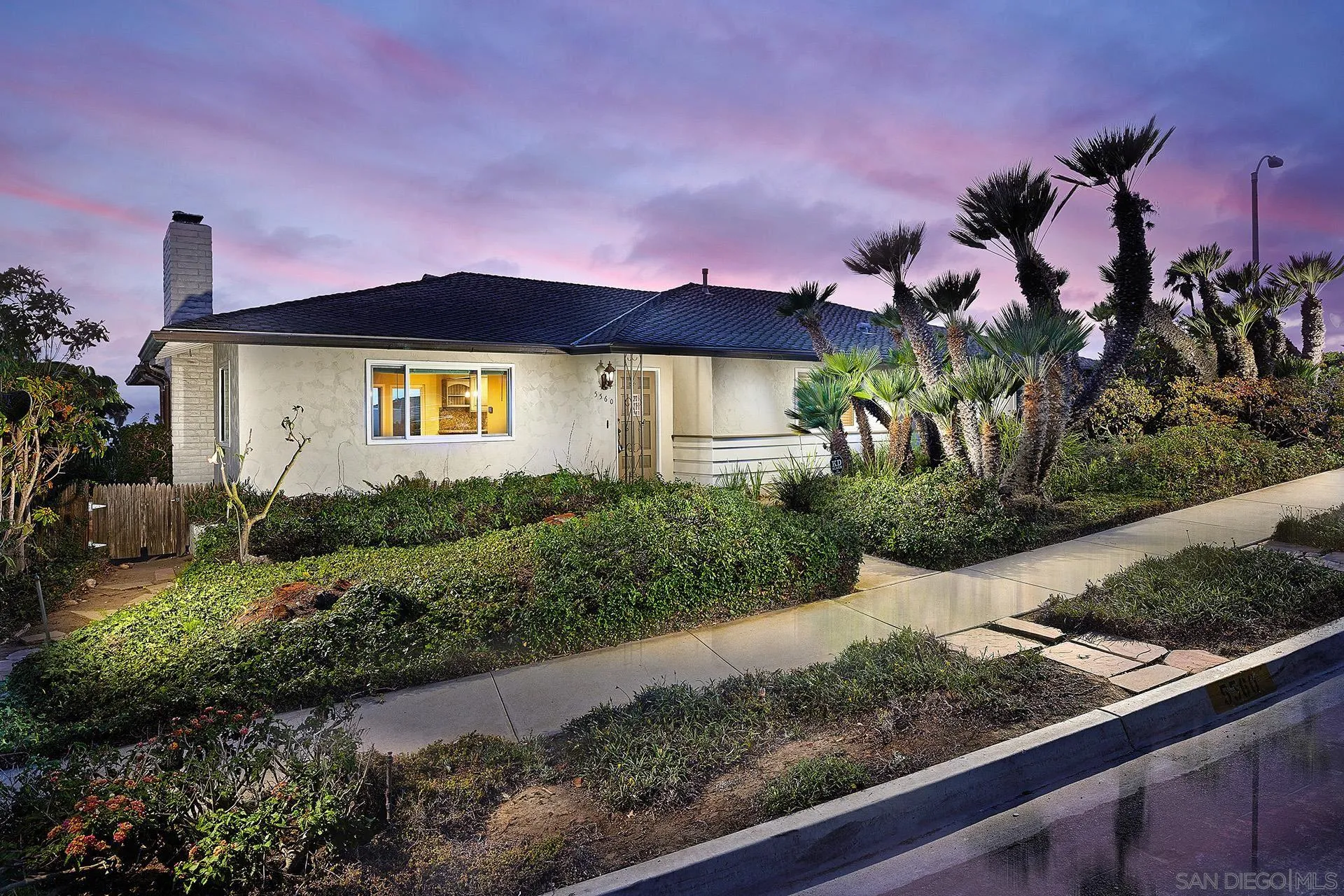 5560 Moonlight Lane La Jolla, CA 92037 - Photo 2 of 48 a front view of a house with a yard