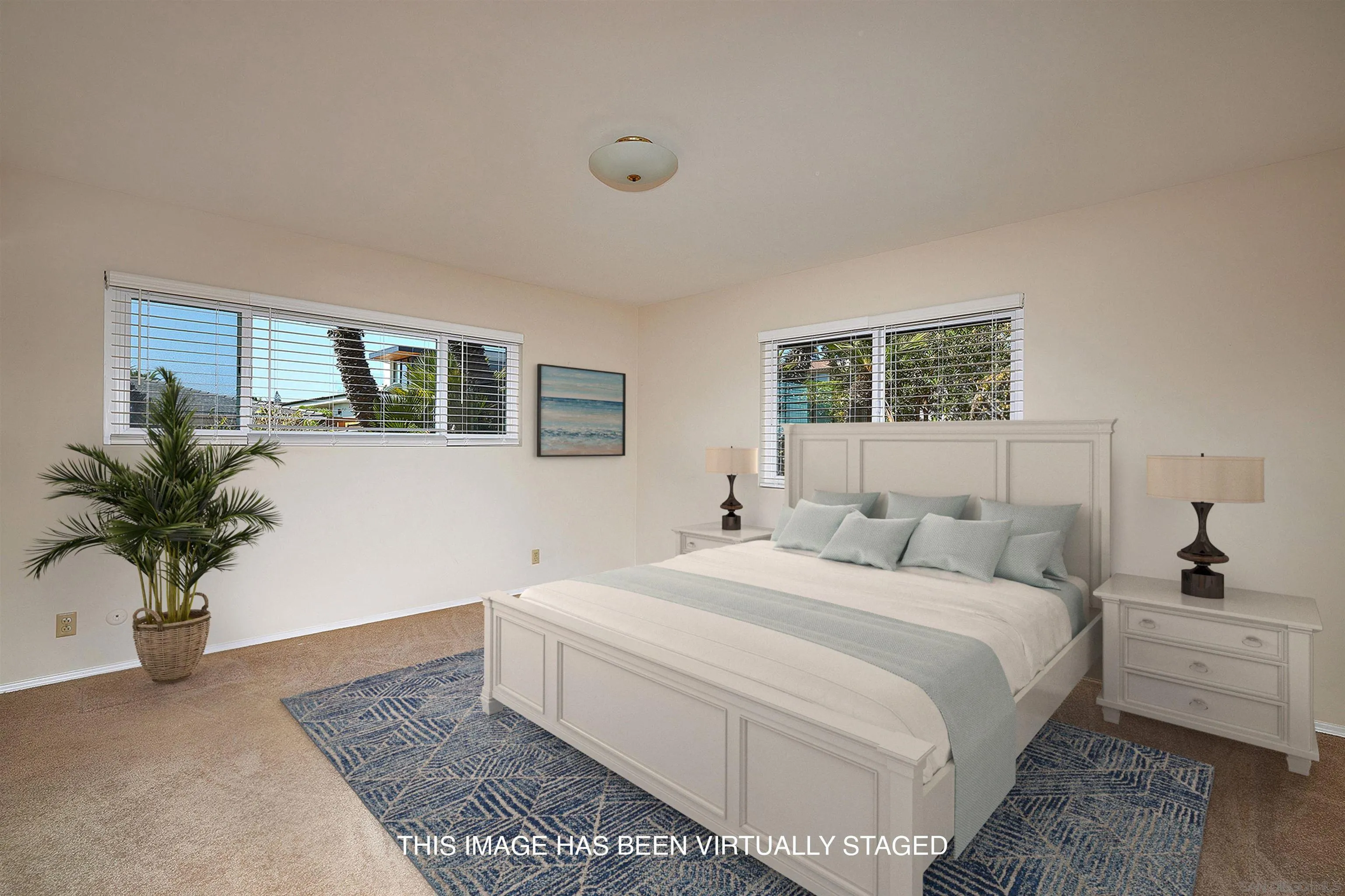 5560 Moonlight Lane La Jolla, CA 92037 - Photo 28 of 48 a bedroom with a large bed plant and a window