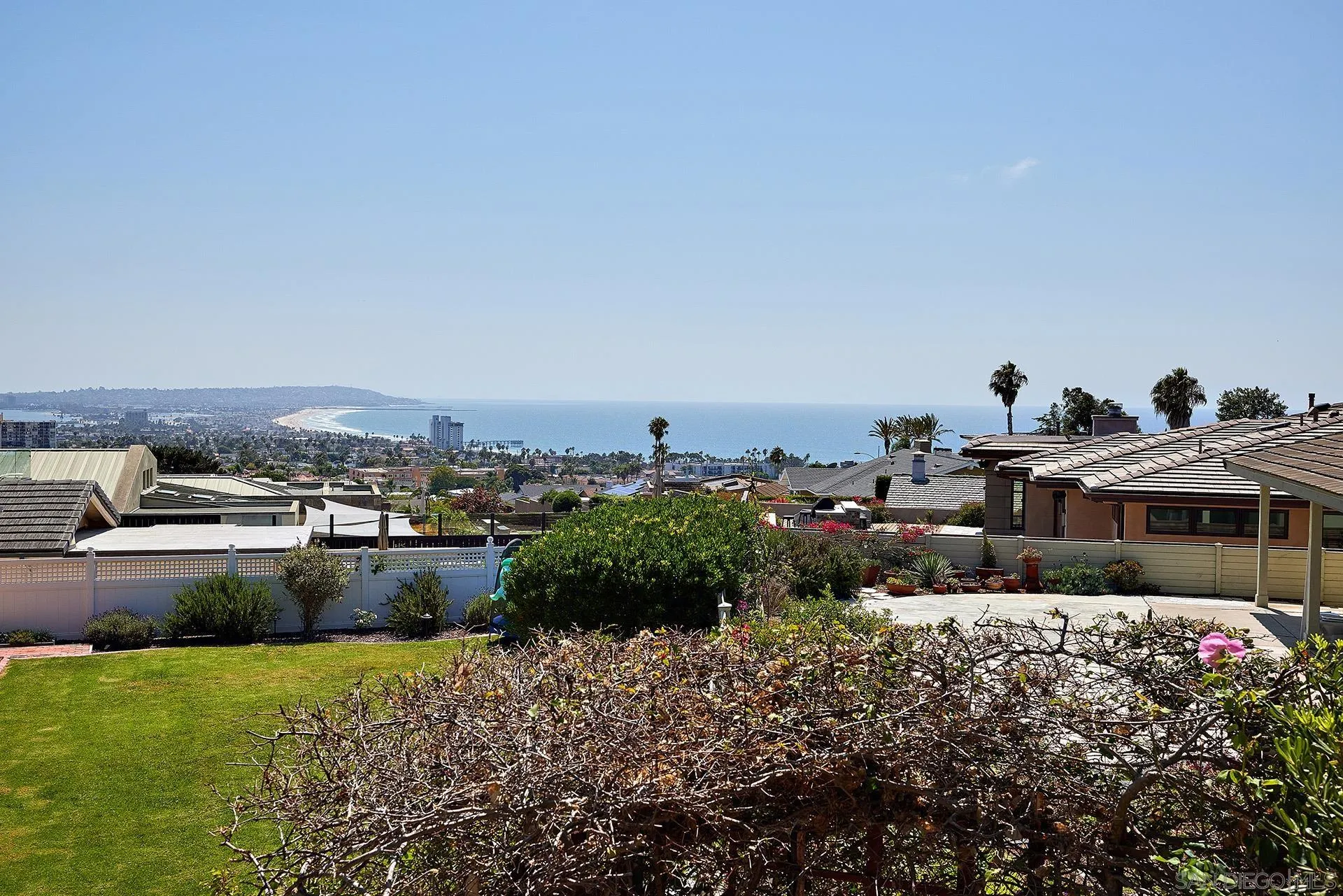 5560 Moonlight Lane La Jolla, CA 92037 - Photo 38 of 48 a view of a house with a yard and a garden