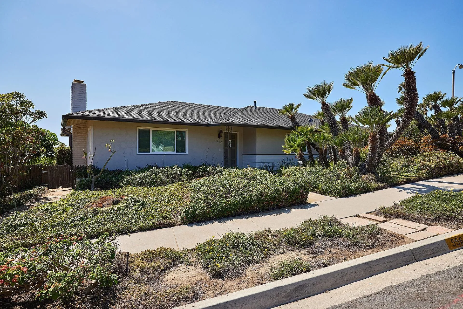 5560 Moonlight Lane La Jolla, CA 92037 - Photo 9 of 48 a front view of house with a garden