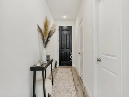 a view of a hallway with seating area