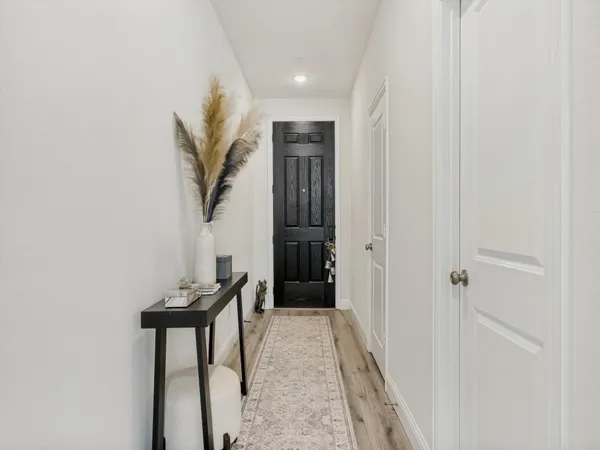 a view of a hallway with seating area