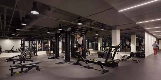 a room with furniture pool table wooden floor and window