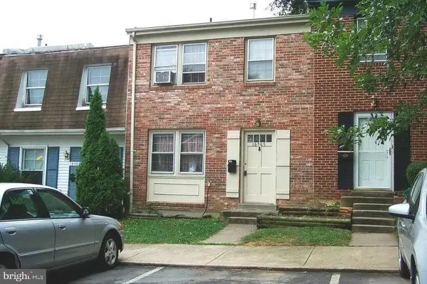 a view of a car parked front of a house