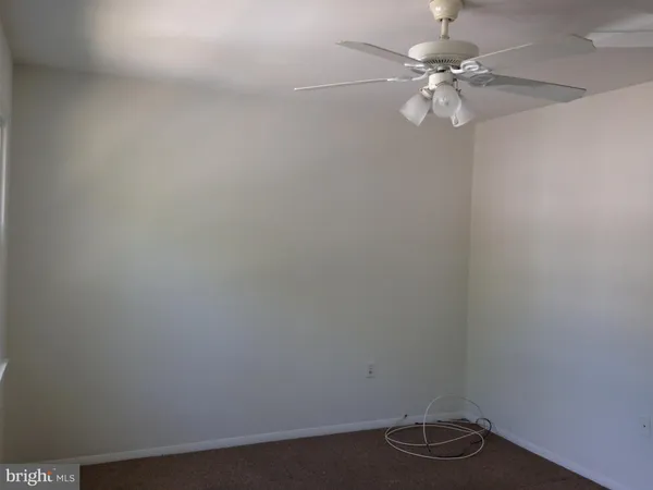 a view of a small space with a fan