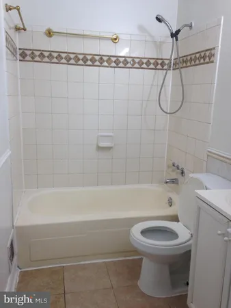 a bathroom with a shower a toilet and a shower
