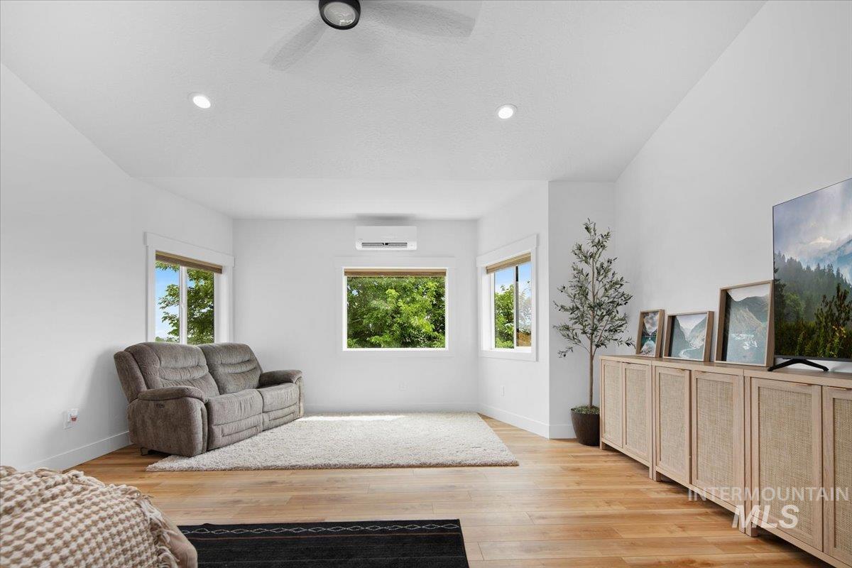 8365 Rustin Road Middleton, ID 83644 - Photo 17 of 48 Huge Master suite with light wood-style flooring, ceiling fan, and recessed lighting