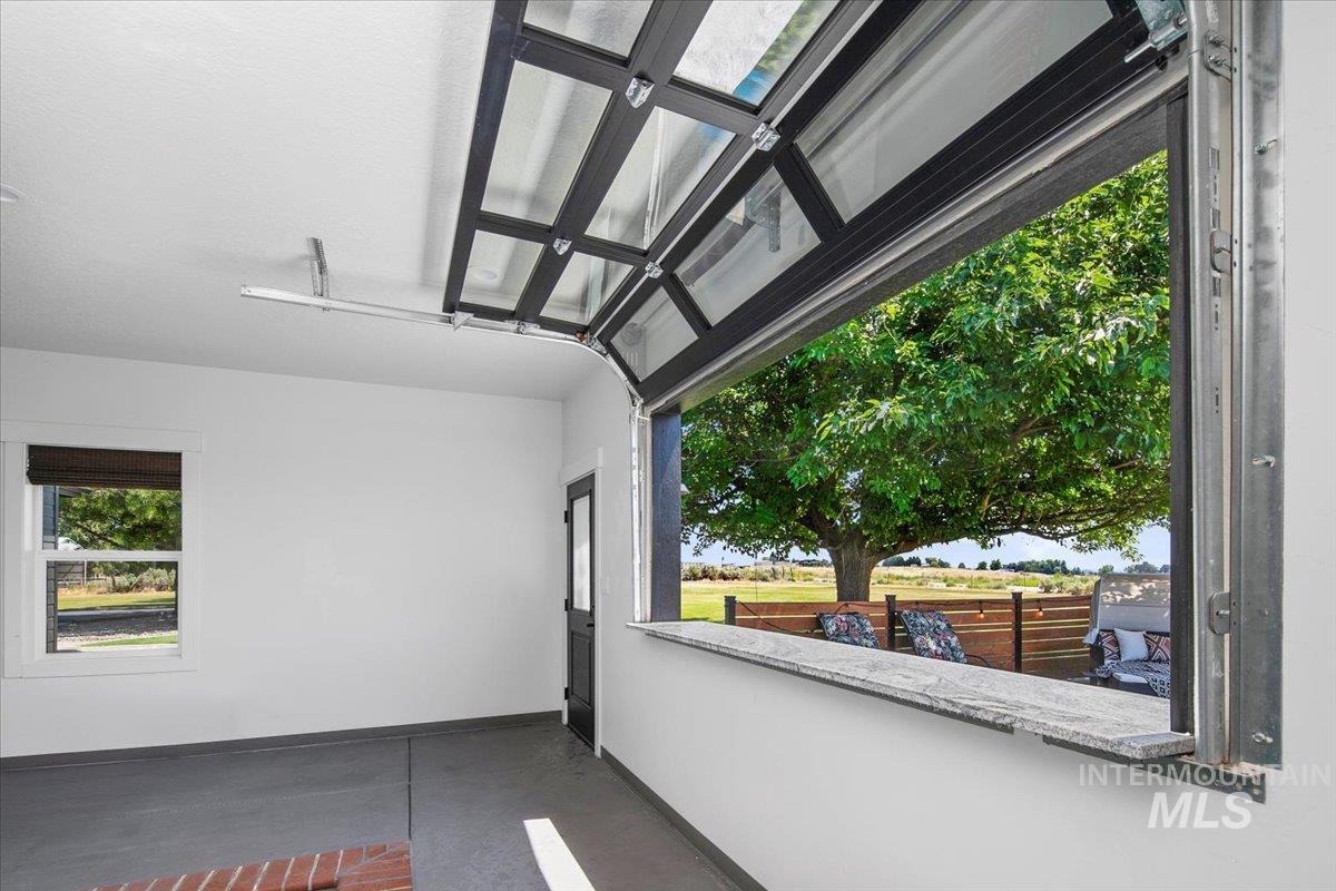 8365 Rustin Road Middleton, ID 83644 - Photo 28 of 48 View of patio / terrace through roll up bar at indoor pool.