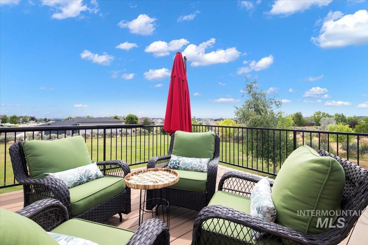 8365 Rustin Road Middleton, ID 83644 - Photo 34 of 48 Wooden terrace featuring an outdoor hangout area off of the great room.