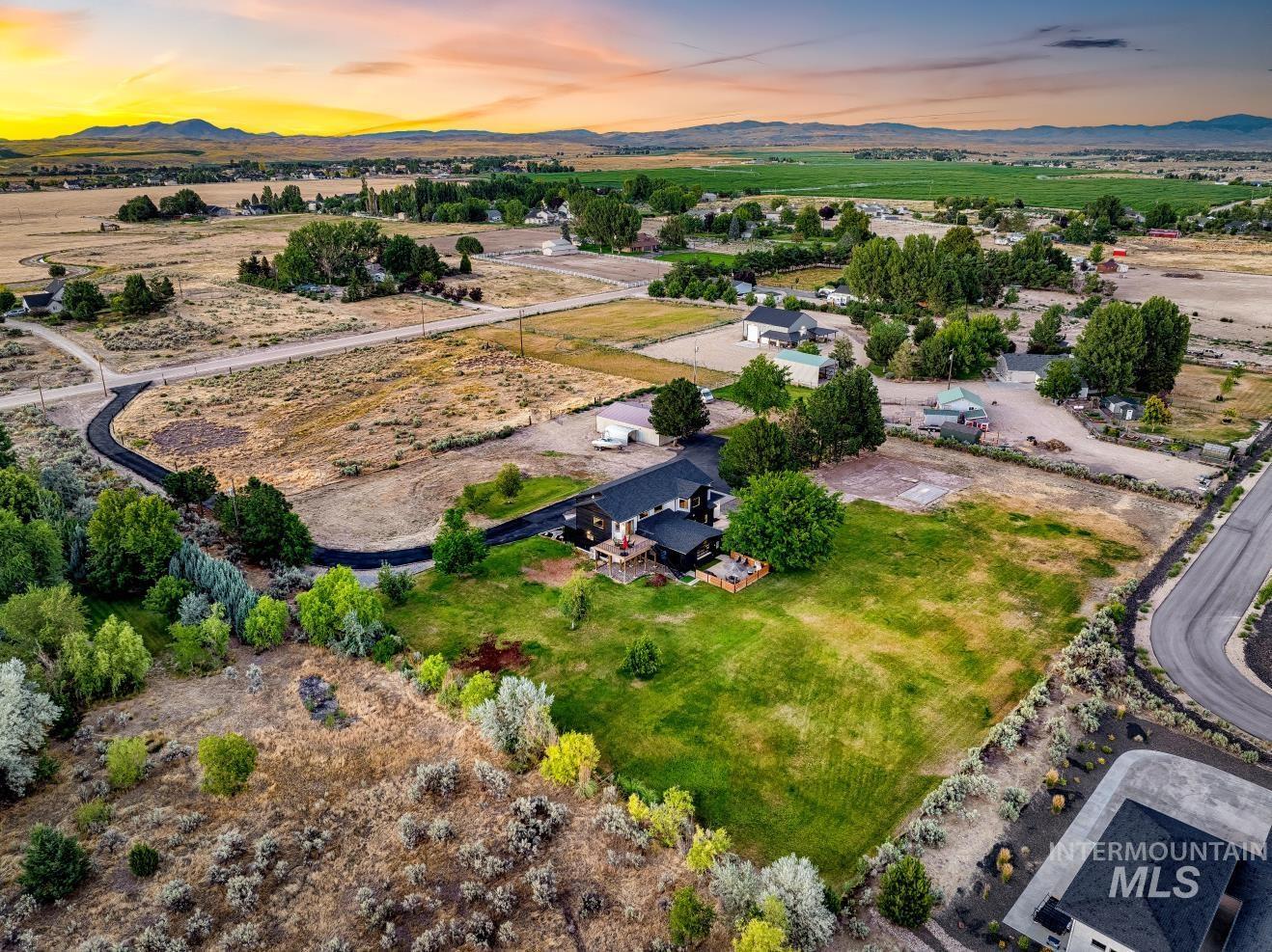 8365 Rustin Road Middleton, ID 83644 - Photo 46 of 48 Drone / aerial view over property of a mountain backdrop