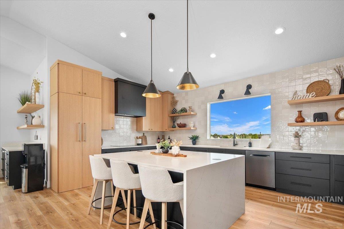 8365 Rustin Road Middleton, ID 83644 - Photo 6 of 48 Kitchen featuring open shelves, light brown cabinets, a breakfast island, light countertops, and decorative backsplash