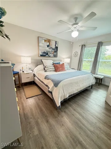 a bedroom with a bed and large mirror