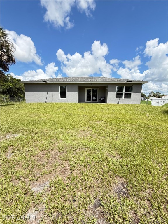 3006 Base Court LaBelle, FL 33935 - Photo 17 of 19 a view of a house with a yard
