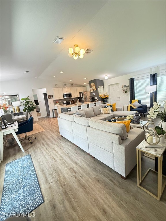 3006 Base Court LaBelle, FL 33935 - Photo 5 of 19 a living room with furniture and a wooden floor