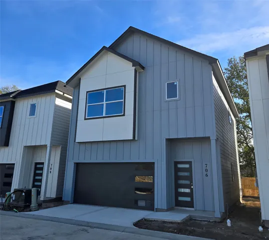 a front view of a house with a garage