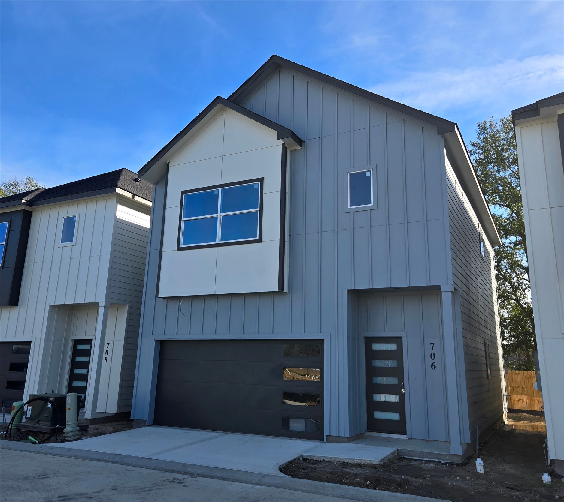 a front view of a house with a garage