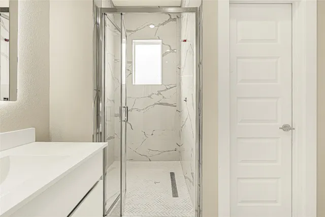 a bathroom with a bathtub and shower