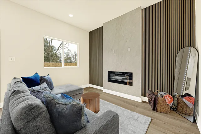 a bedroom with furniture and a window