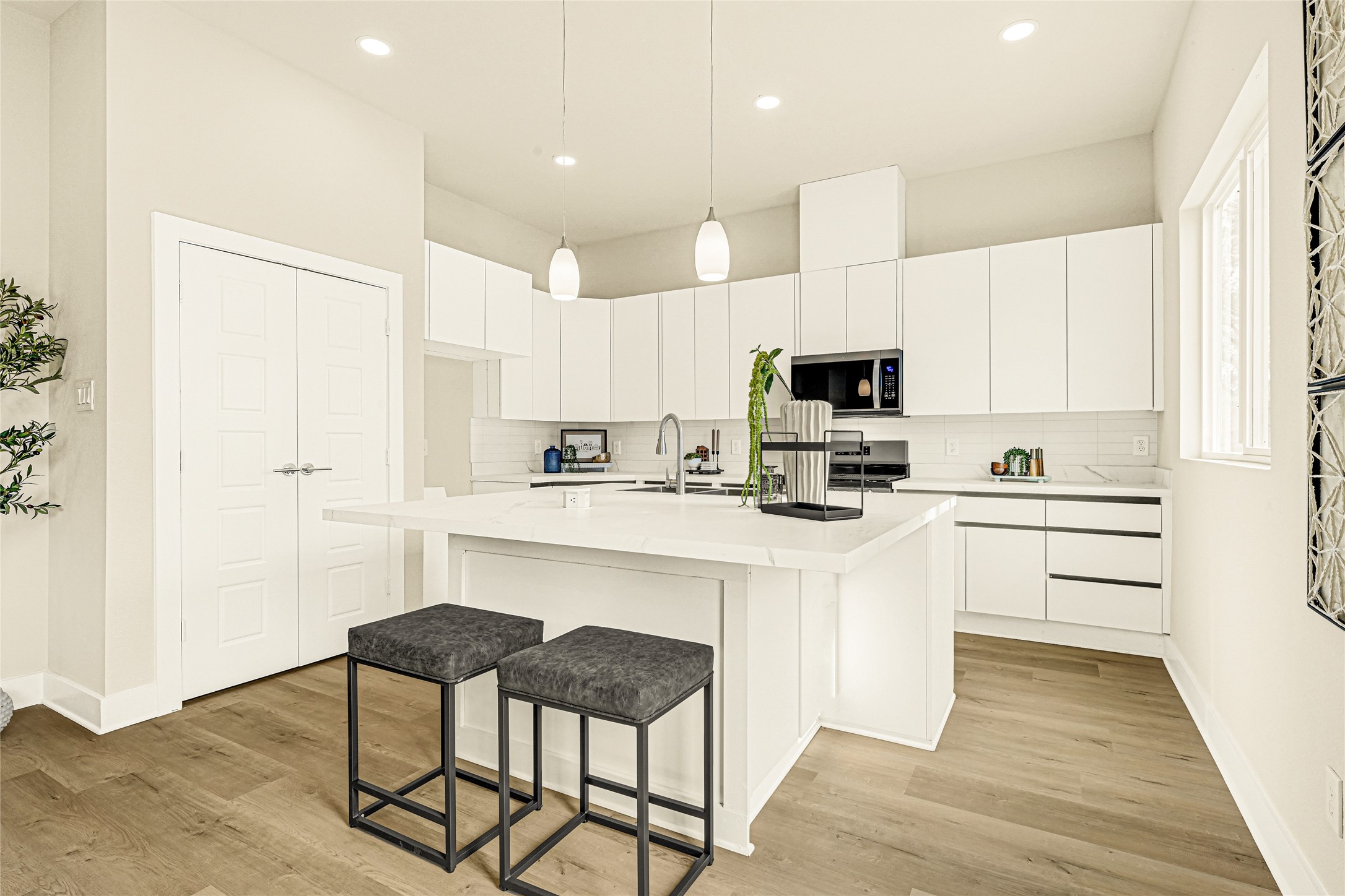 706 Savonna Houston, TX 77076 - Photo 7 of 26 a kitchen with stainless steel appliances white cabinets a sink and a stove