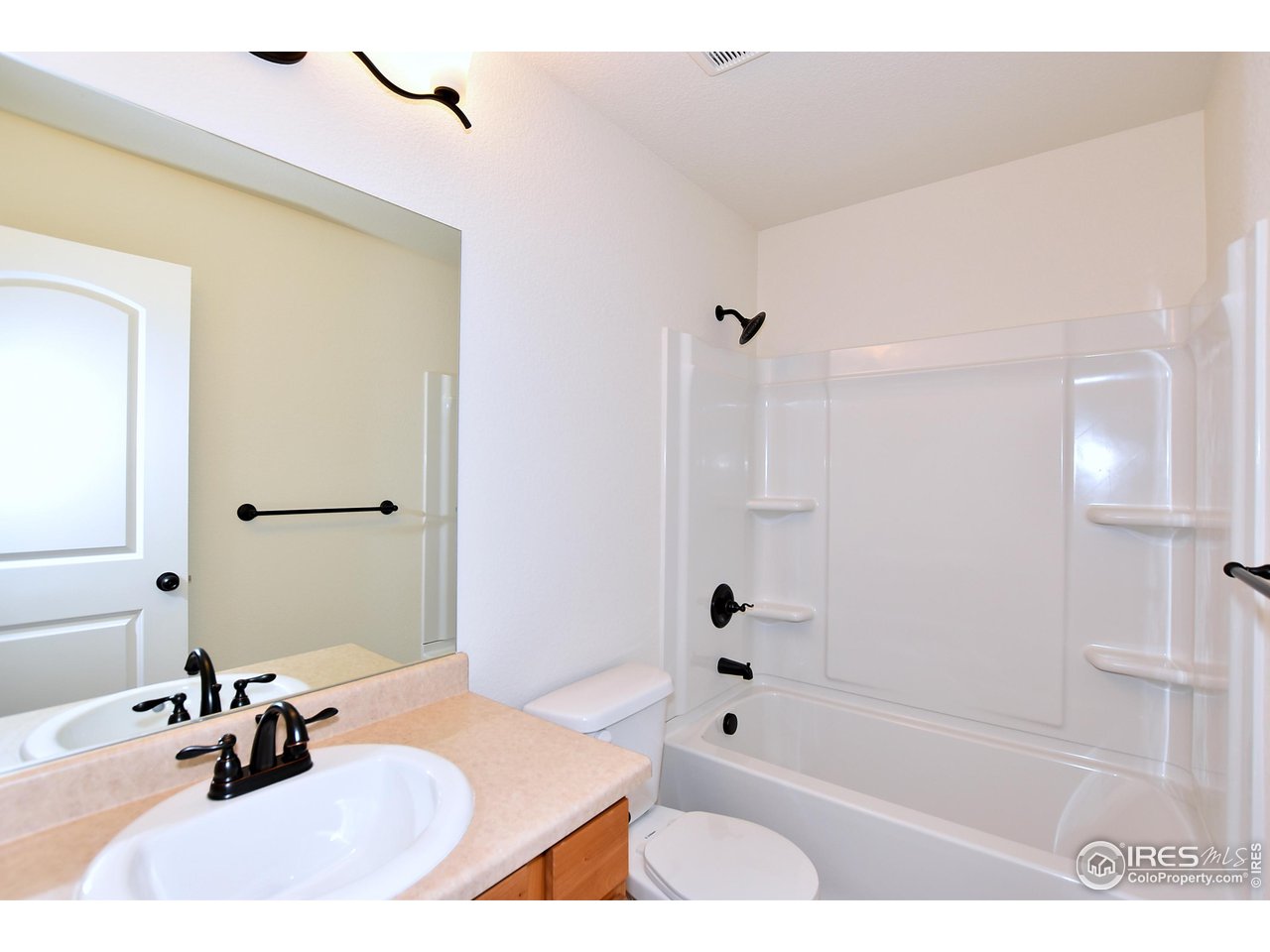 2316 Sublime Drive Windsor, CO 80550 - Photo 28 of 37 a bathroom with a sink a bathtub and a shower