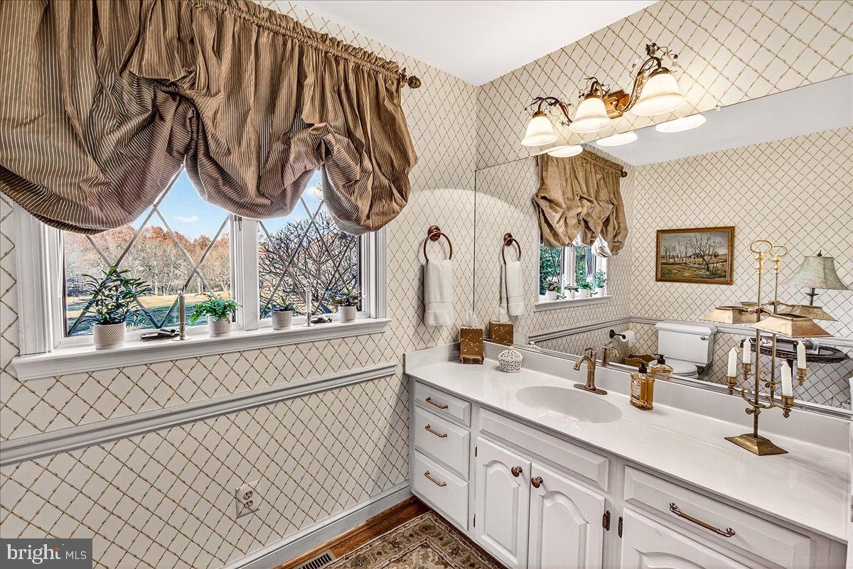 6400 Griffith Road Gaithersburg, MD 20882 - Photo 15 of 70 a bathroom with a sink and a mirror
