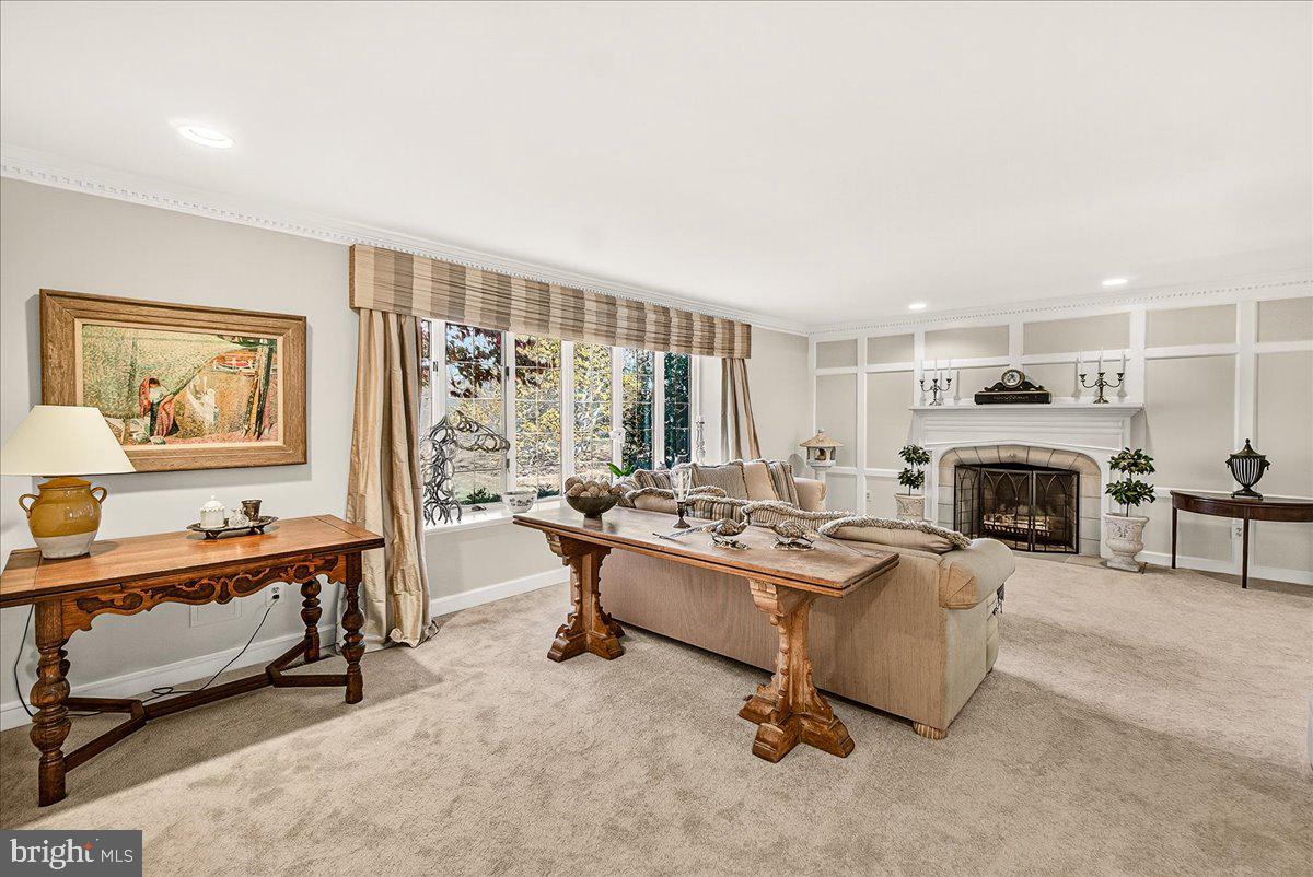 6400 Griffith Road Gaithersburg, MD 20882 - Photo 17 of 70 a living room with furniture large window and a fireplace