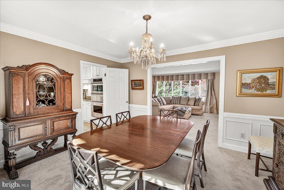6400 Griffith Road Gaithersburg, MD 20882 - Photo 20 of 70 a view of a dining room with furniture window and outside view