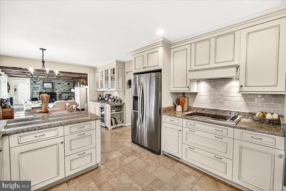 6400 Griffith Road Gaithersburg, MD 20882 - Photo 24 of 70 a kitchen with white cabinets and refrigerator