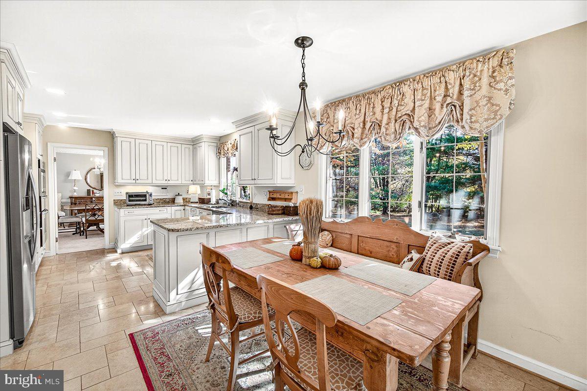 6400 Griffith Road Gaithersburg, MD 20882 - Photo 26 of 70 a view of a dining room with furniture window and outside view