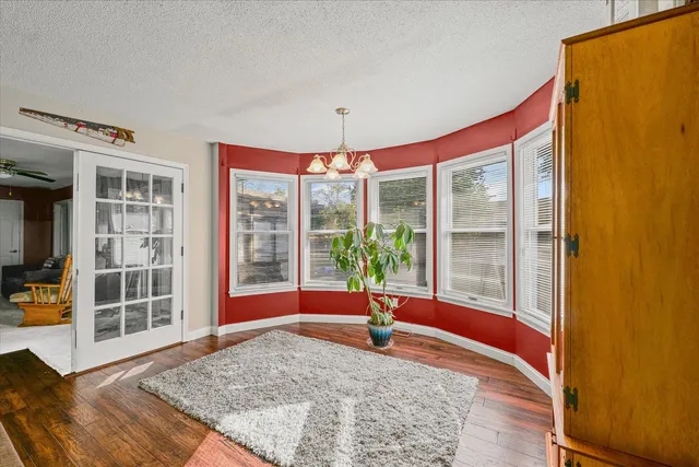 a view of a livingroom with furniture and a flat screen tv