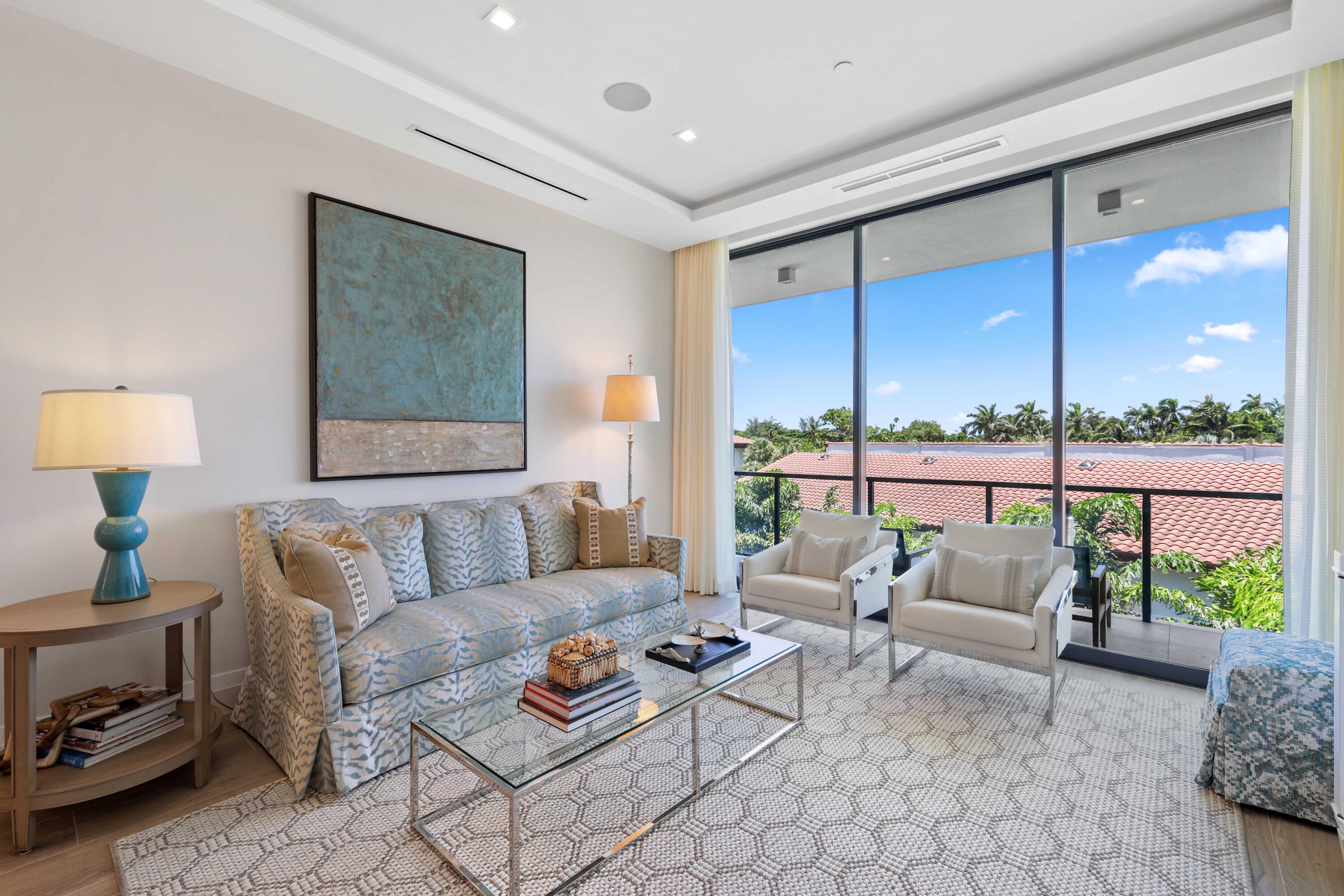1177 George Bush Boulevard, Unit 306 Delray Beach, FL 33483 - Photo 20 of 66 a living room with furniture and a large window