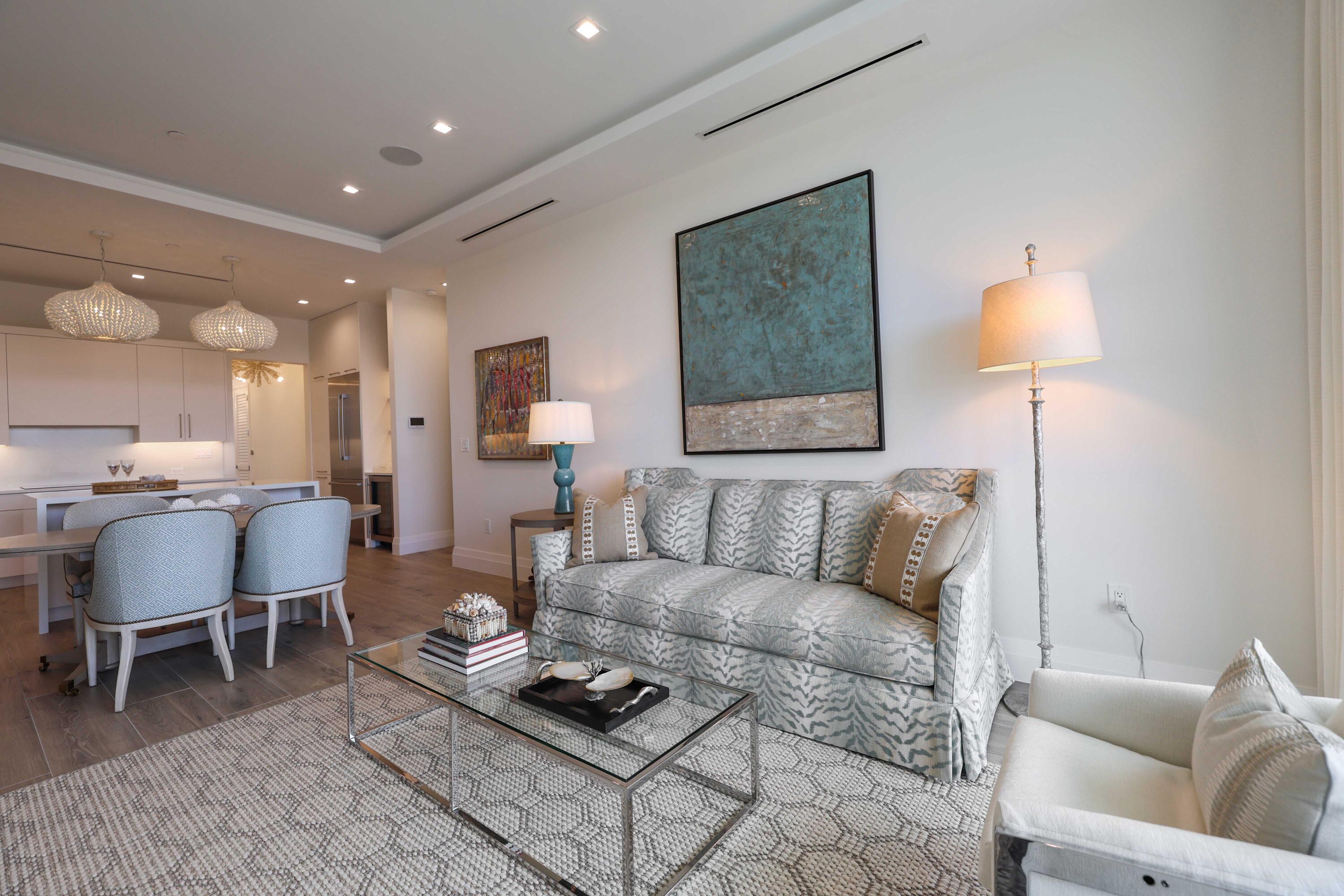 1177 George Bush Boulevard, Unit 306 Delray Beach, FL 33483 - Photo 21 of 66 a living room with furniture a rug and a lamp