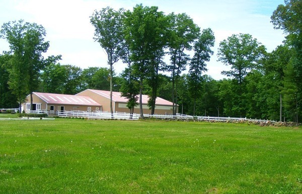 32 Ayers Road Monson, MA 01057 - Photo 18 of 30 a house with a garden and swimming pool