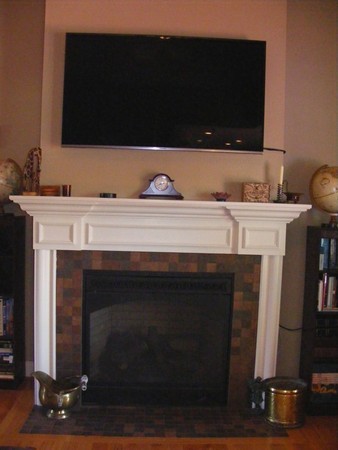 32 Ayers Road Monson, MA 01057 - Photo 8 of 30 a living room with a fireplace and a flat screen tv
