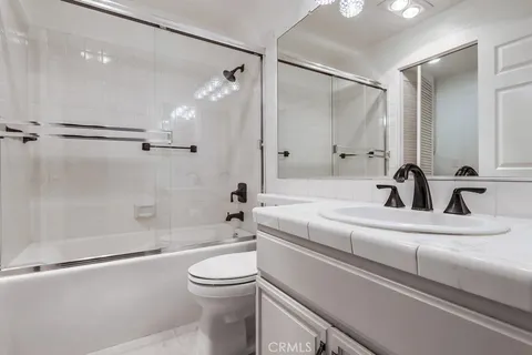 a bathroom with a sink a toilet and a bathtub