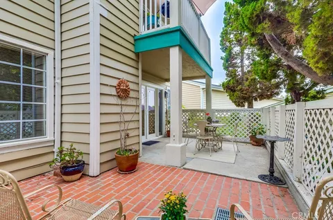 a view of a chairs and table in the patio